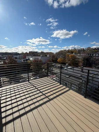 a view of barbeque grill with wooden floor and city view