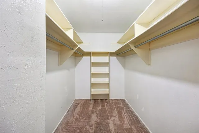a view of an empty walk in closet