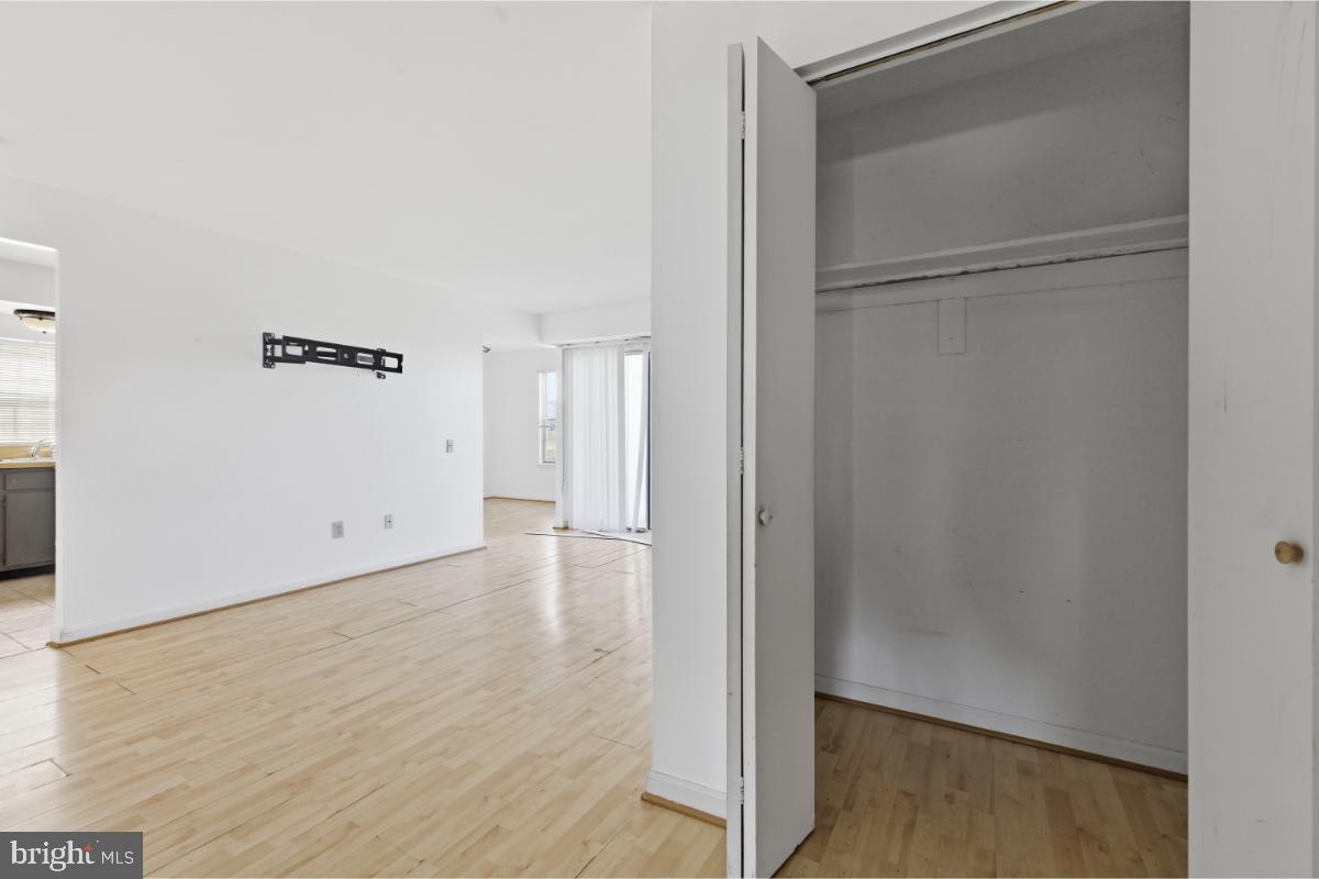 1403 Key Parkway, Unit 201 Frederick, MD 21702 - Photo 18 of 20 a view of empty room with wooden floor