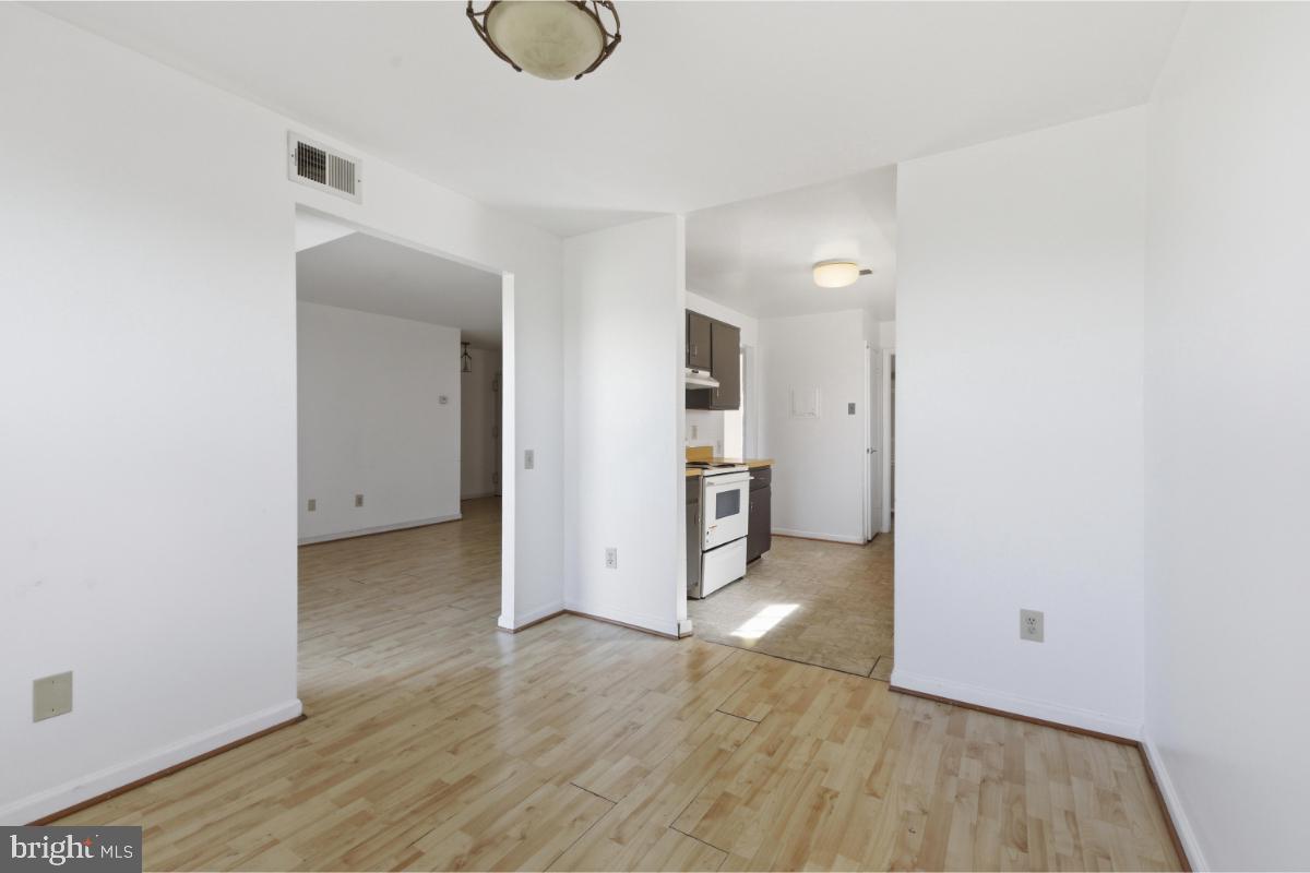 1403 Key Parkway, Unit 201 Frederick, MD 21702 - Photo 7 of 20 a view of a kitchen with wooden floor