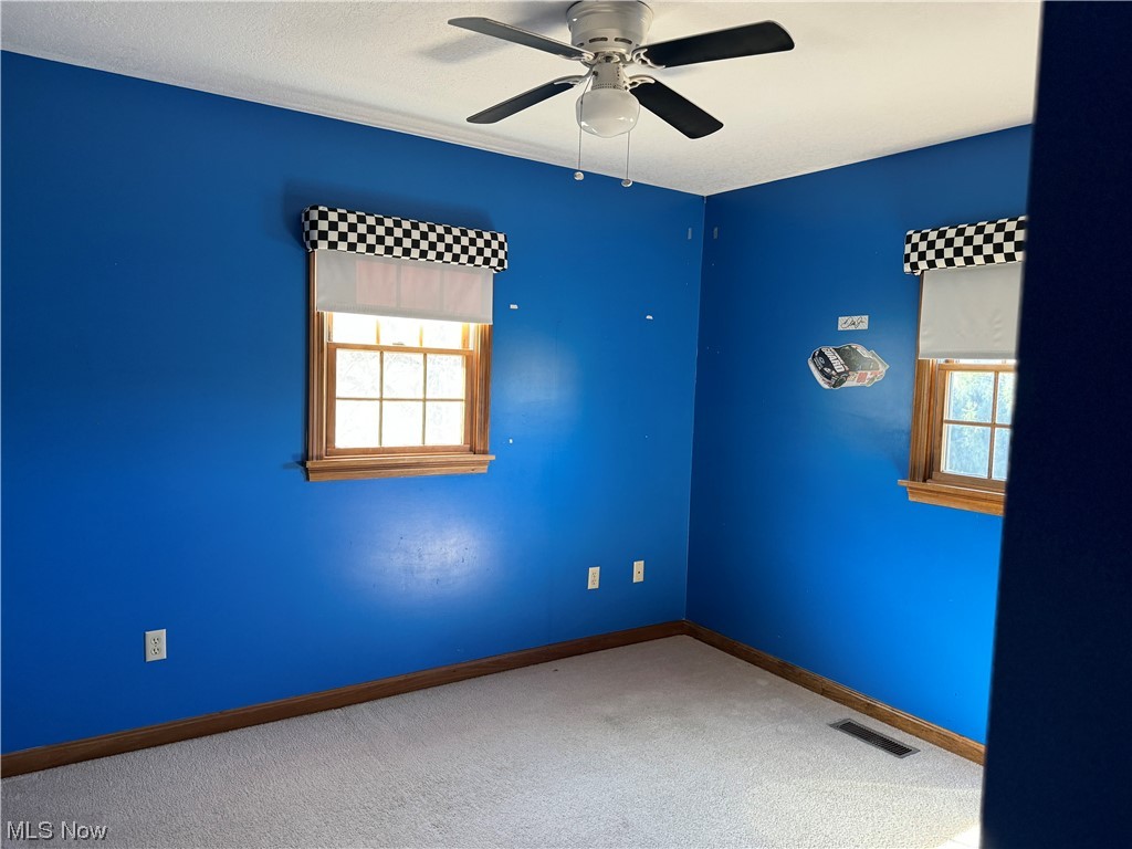 2812 Tabor Ridge Road Northeast Mineral City, OH 44656 - Photo 15 of 23 Carpeted empty room featuring ceiling fan