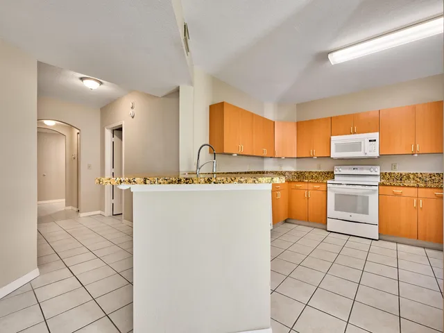a bathroom with a sink vanity and mirror