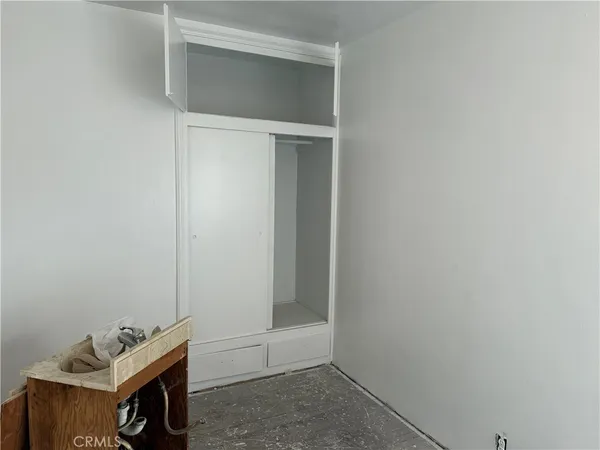 a room with a bed and a window