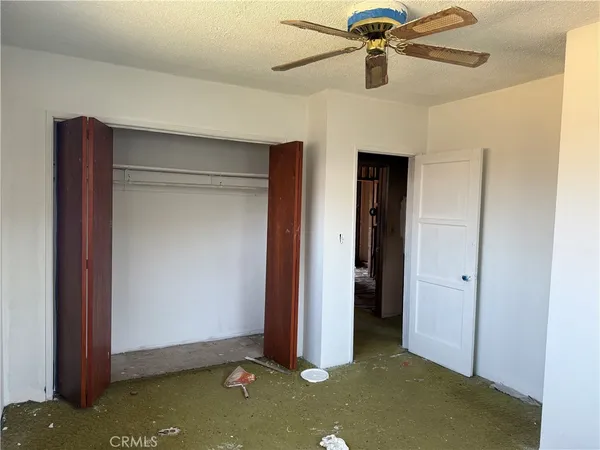 wooden floor and ceiling fan in a room