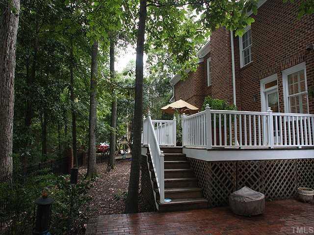 3201 Brantford Place Raleigh, NC 27607 - Photo 12 of 12 a view of a wooden deck with chairs and wooden fence