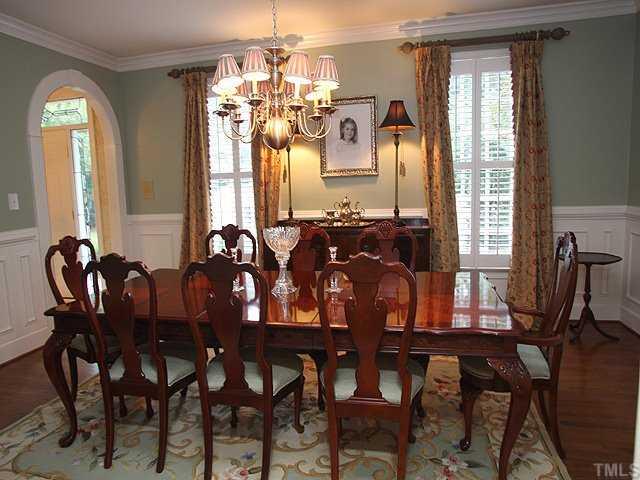 3201 Brantford Place Raleigh, NC 27607 - Photo 3 of 12 a view of a dining room with furniture window and wooden floor