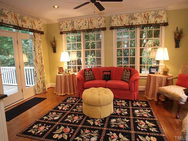 3201 Brantford Place Raleigh, NC 27607 - Photo 6 of 12 a living room with furniture and a floor to ceiling window