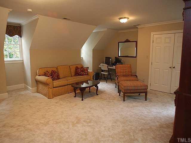 3201 Brantford Place Raleigh, NC 27607 - Photo 9 of 12 a living room with furniture and a potted plant