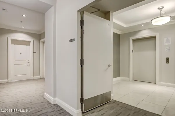 a bathroom with a bathtub and a window