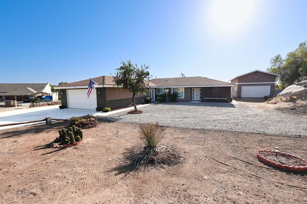 16465 Holcomb Way Riverside, CA 92504 - Photo 43 of 49 a view of a house with backyard and sitting area