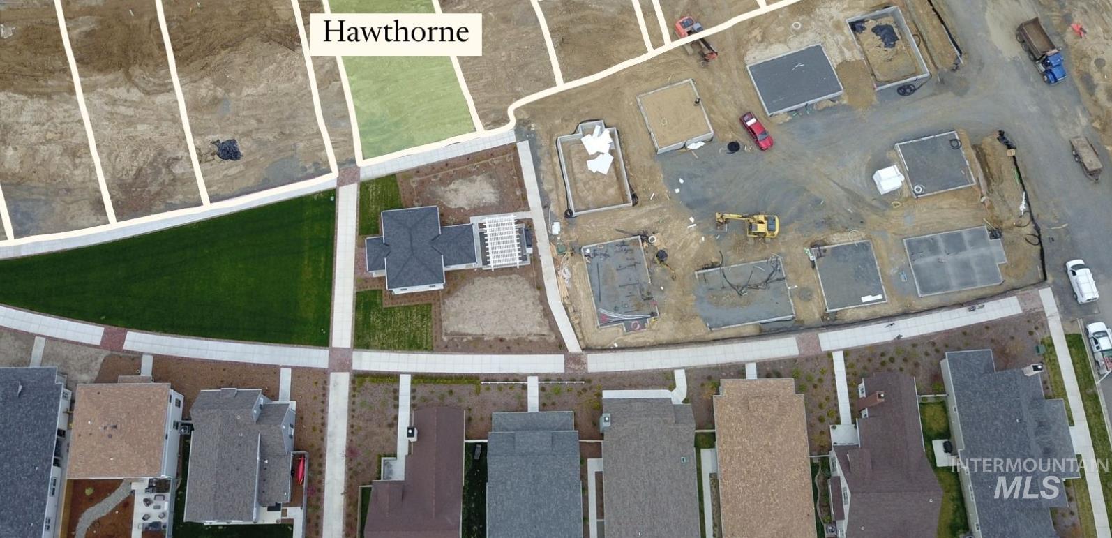 Tbd Tbd Cottage Lane Moscow, ID 83843 - Photo 9 of 14 Aerial overview of a developing residential area featuring multiple single-family homes with pitched roofs, manicured common green spaces, and established hardscaping
