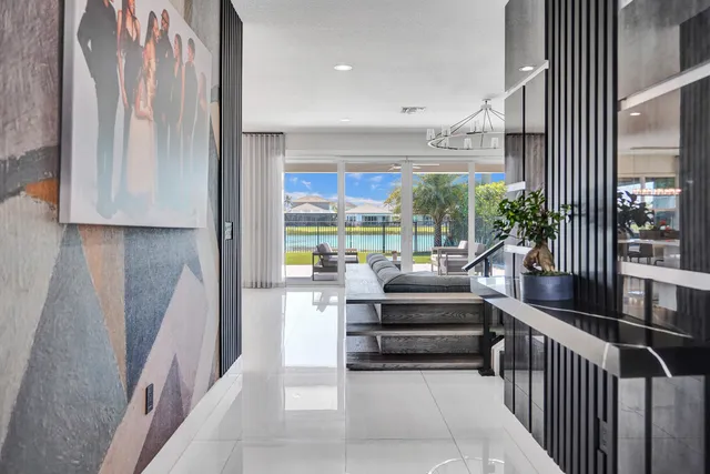 a living room with furniture or kitchen view and a chandelier
