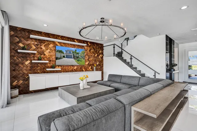 a living room with furniture and flowers