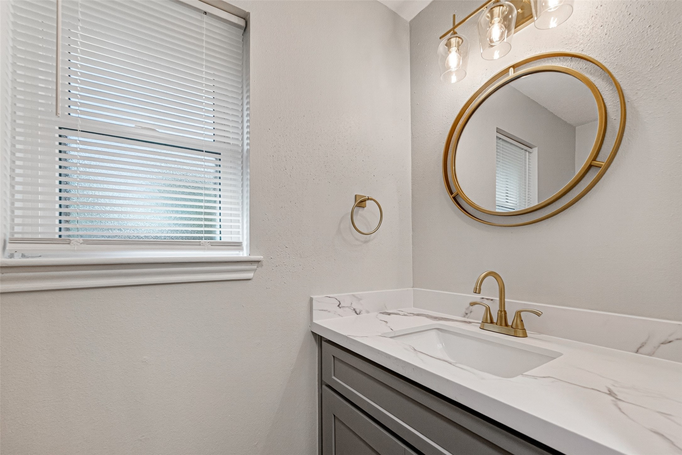 25503 Foxbriar Lane Spring, TX 77373 - Photo 17 of 45 a bathroom with a granite countertop sink and a mirror