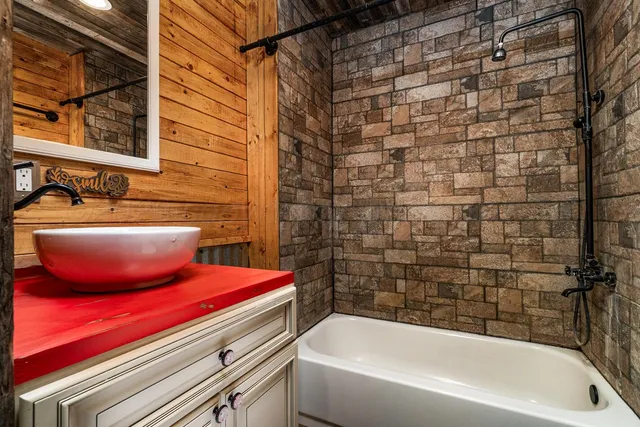 a bathroom with a sink and bathtub