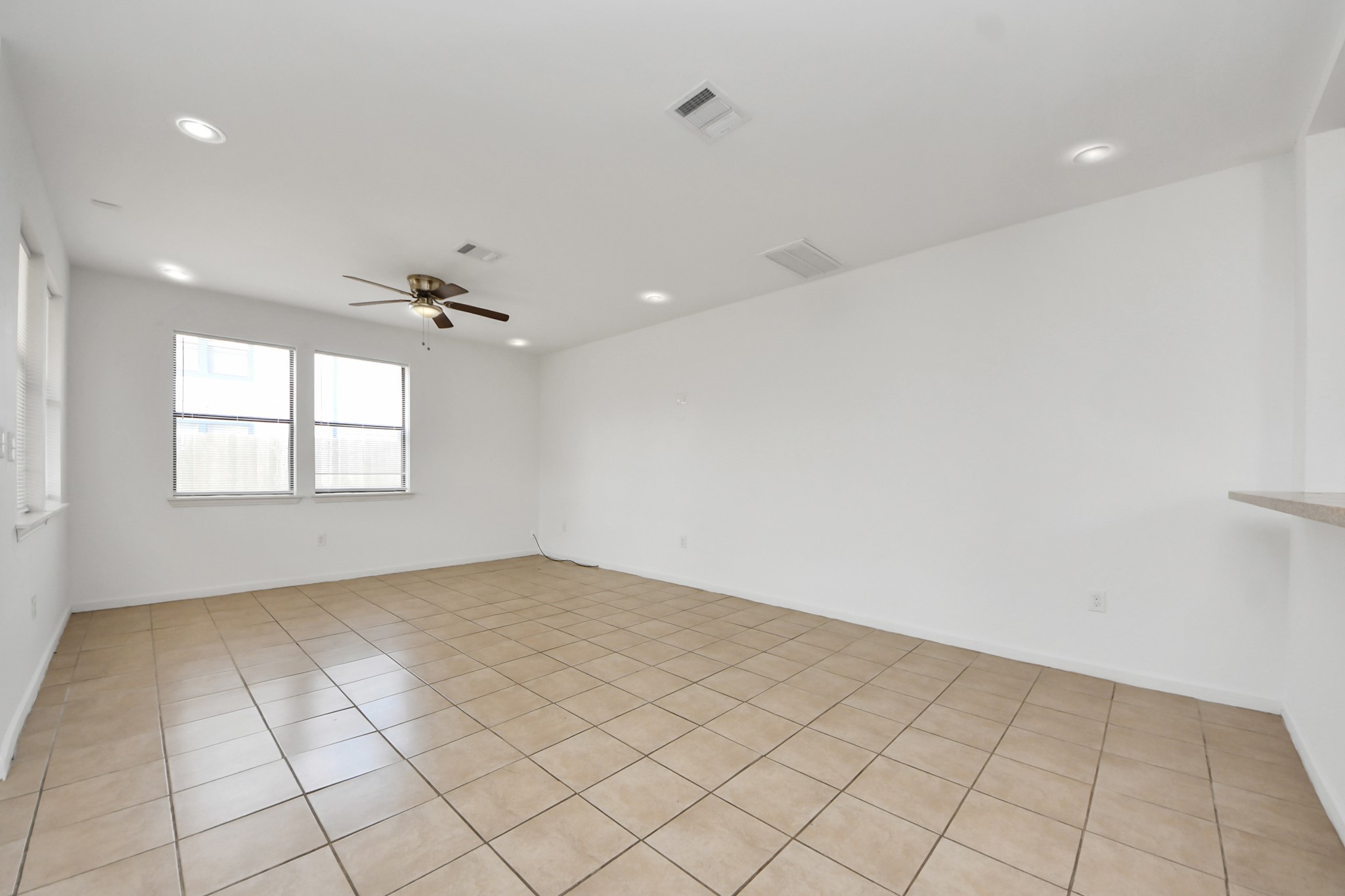 4327 Oak Ridge Drive, Unit A Pasadena, TX 77503 - Photo 3 of 20 wooden floor in an empty room with a window