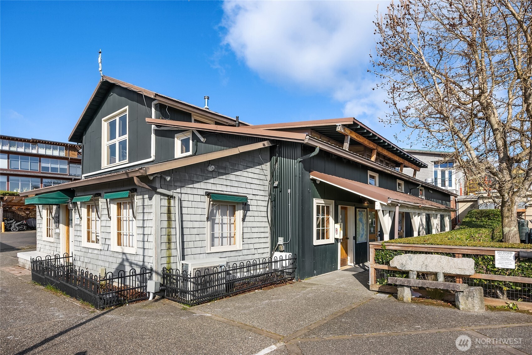 141 Parfitt Way Southwest, Unit C39 Bainbridge Island, WA 98110 - Photo 23 of 27 a front view of a house with a garage