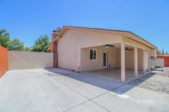 1043 Peg Street Ridgecrest, CA 93555 - Photo 34 of 45 a view of a house with a backyard