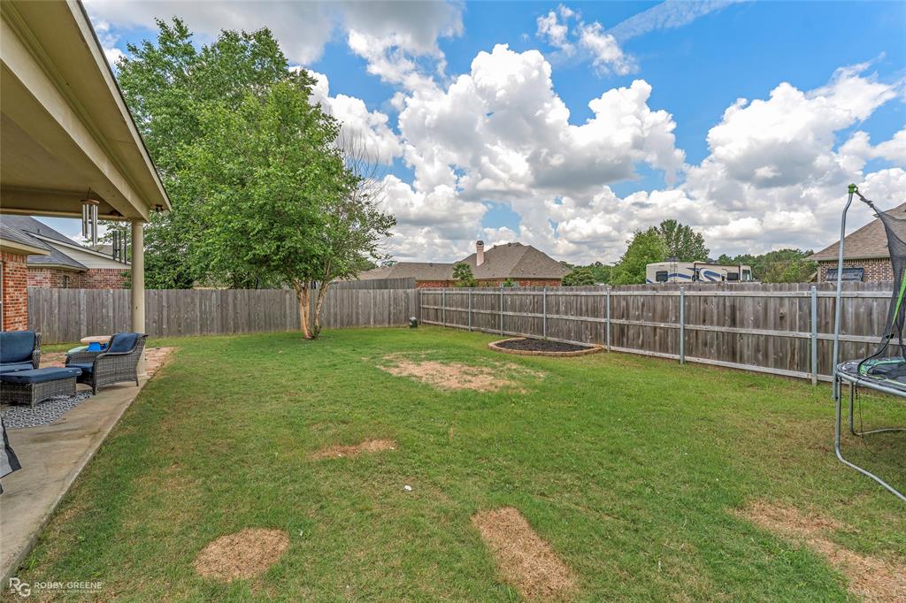 711 Reeds Reef Bossier City, LA 71112 - Photo 34 of 36 a view of a backyard with a garden