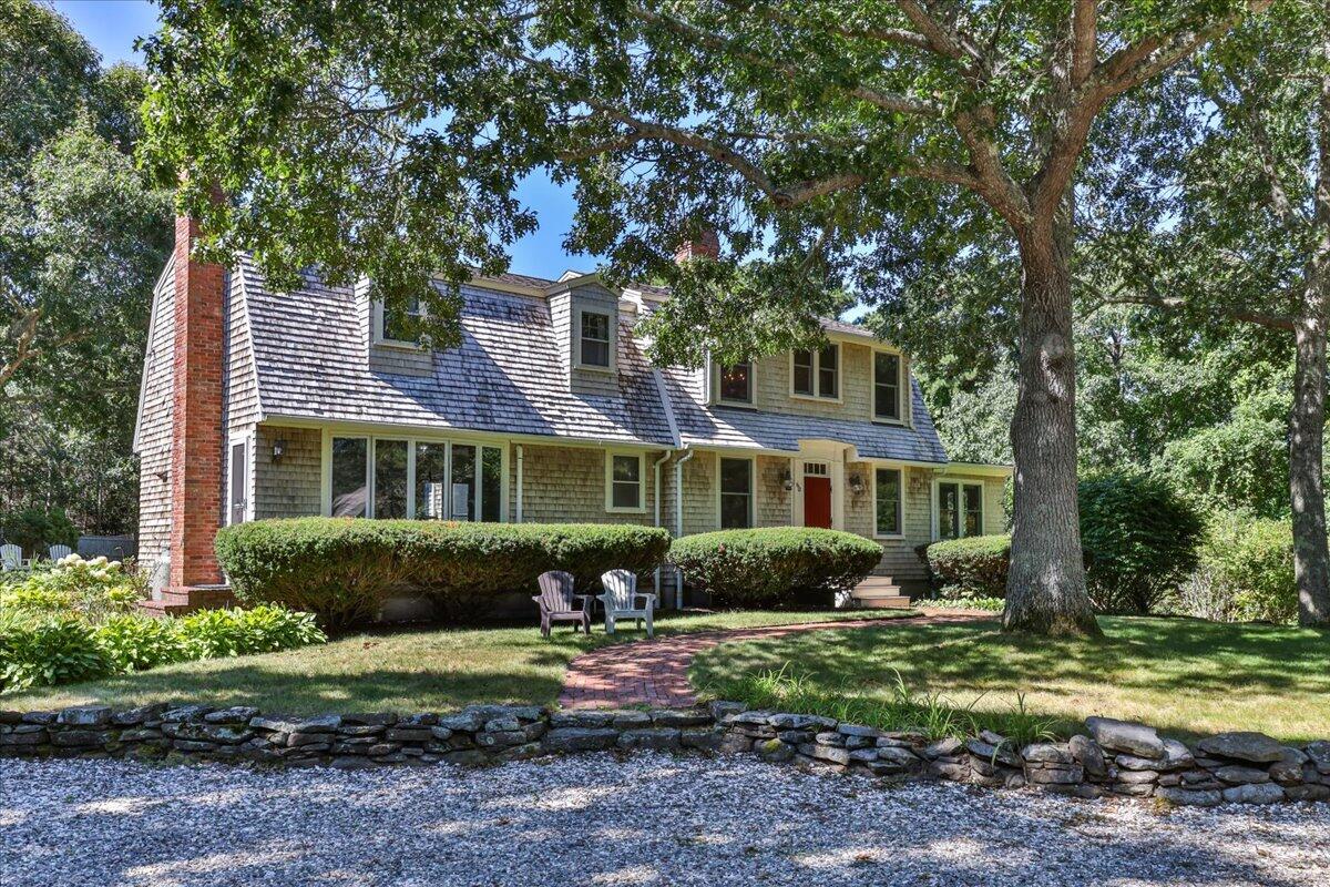 a front view of a house with garden
