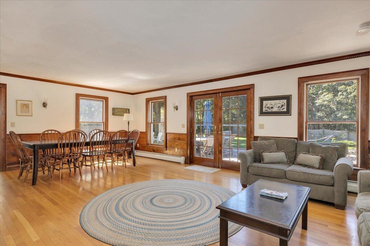 60 Pleasant Point Road Wellfleet, MA 02667 - Photo 19 of 58 a living room with furniture and a large window