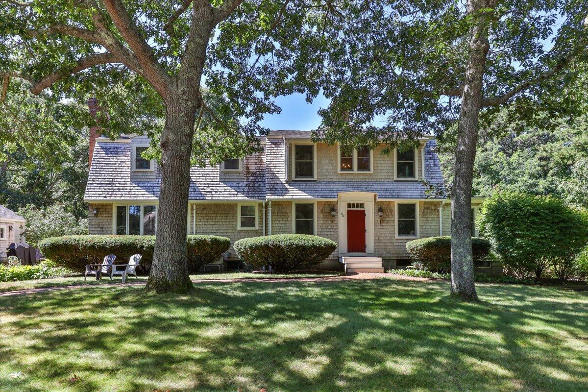 60 Pleasant Point Road Wellfleet, MA 02667 - Photo 2 of 58 a front view of a house with a garden