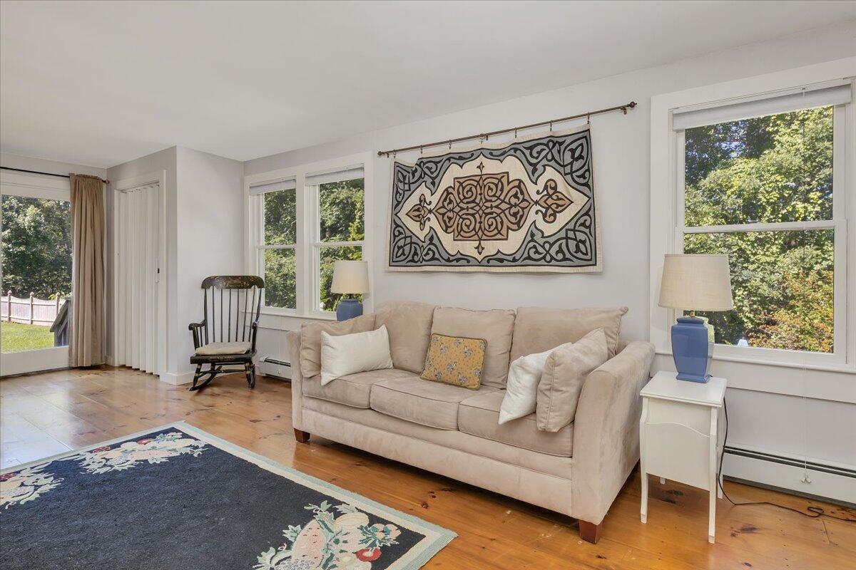 60 Pleasant Point Road Wellfleet, MA 02667 - Photo 27 of 58 a living room with furniture and a large window