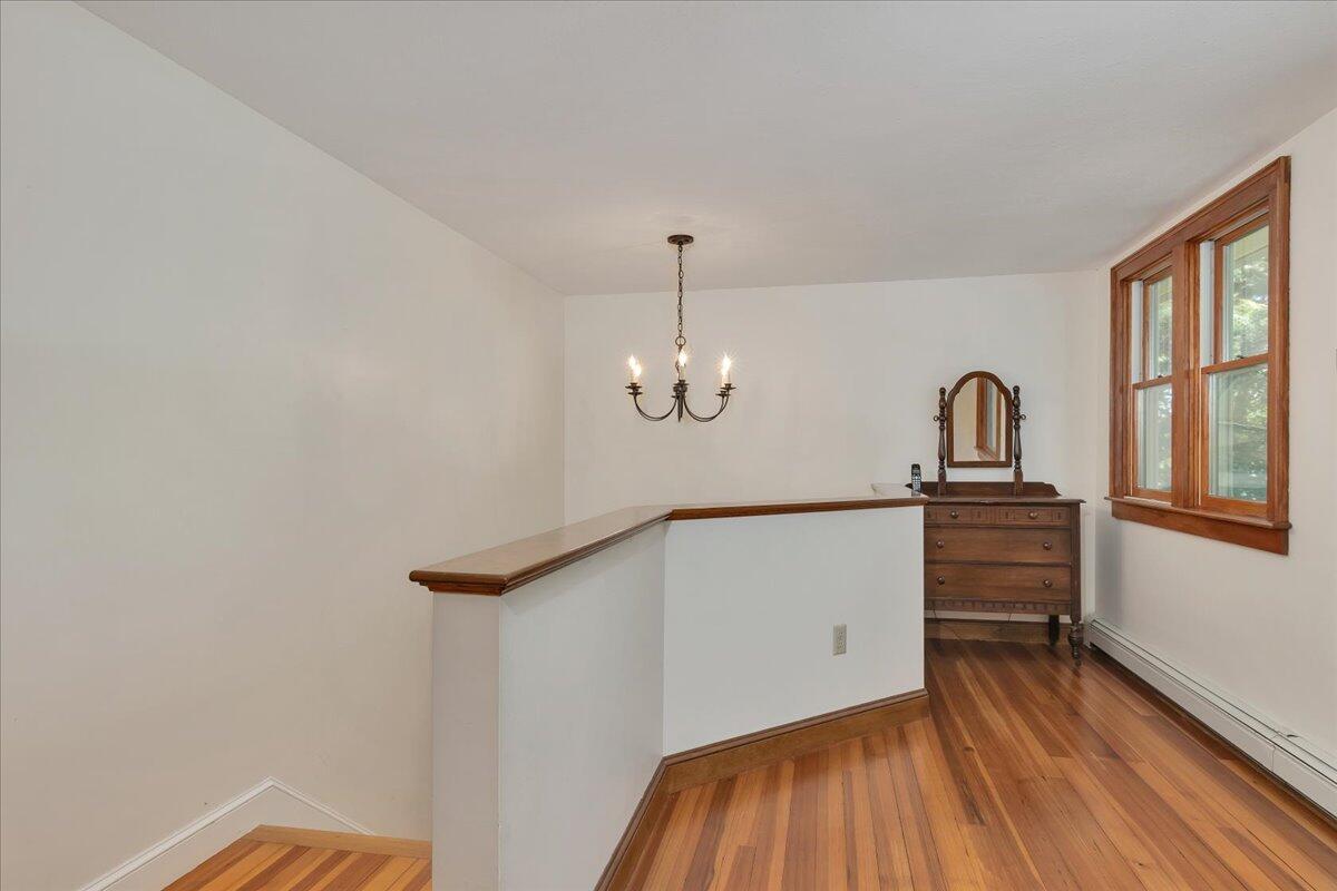 60 Pleasant Point Road Wellfleet, MA 02667 - Photo 30 of 58 a view of a hallway with wooden floor and stairs