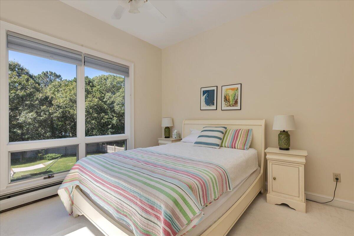 60 Pleasant Point Road Wellfleet, MA 02667 - Photo 35 of 58 a bedroom with a bed and a large window