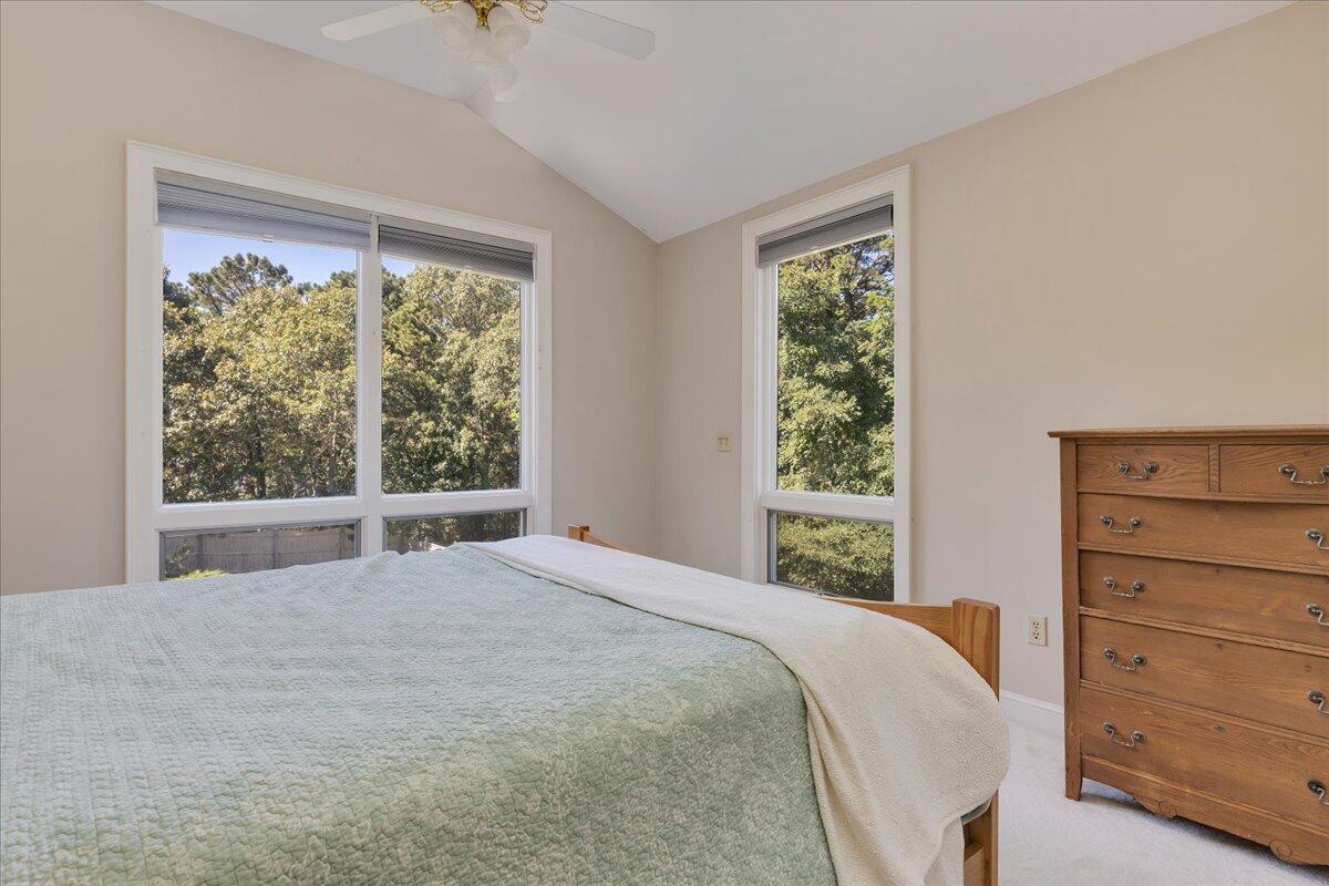 60 Pleasant Point Road Wellfleet, MA 02667 - Photo 38 of 58 a bedroom with a bed a dresser and a window