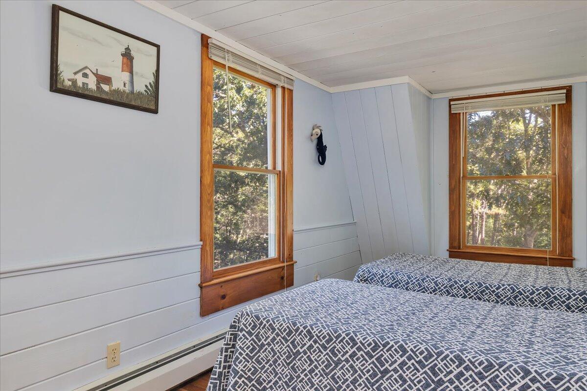 60 Pleasant Point Road Wellfleet, MA 02667 - Photo 39 of 58 a bedroom with a bed and a window