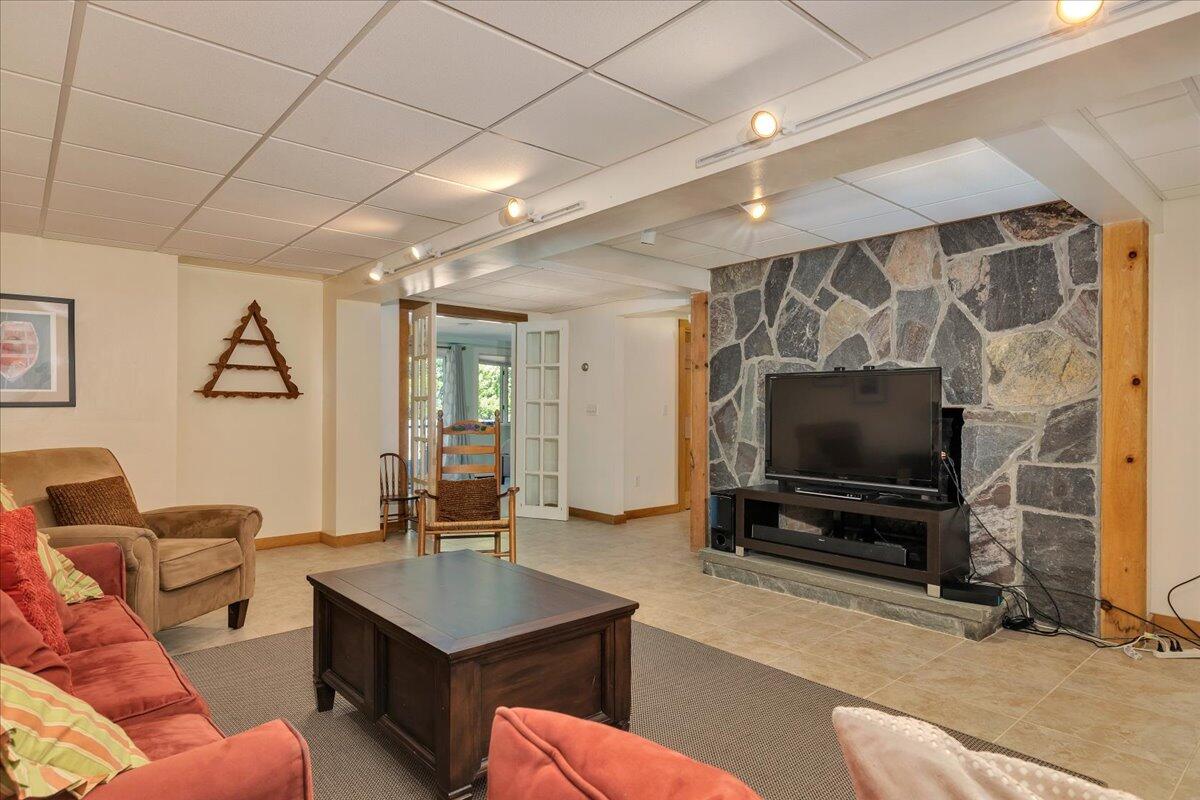 60 Pleasant Point Road Wellfleet, MA 02667 - Photo 42 of 58 a living room with furniture and a flat screen tv