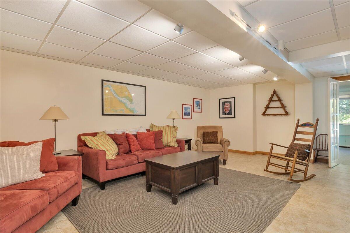 60 Pleasant Point Road Wellfleet, MA 02667 - Photo 44 of 58 a living room with furniture and a wooden floor