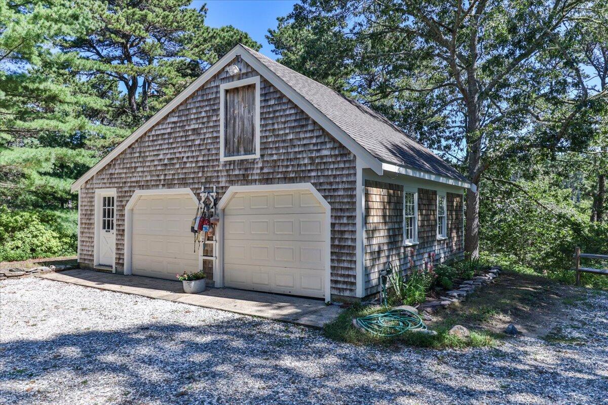 60 Pleasant Point Road Wellfleet, MA 02667 - Photo 52 of 58 a view of a house with a yard plants and large tree