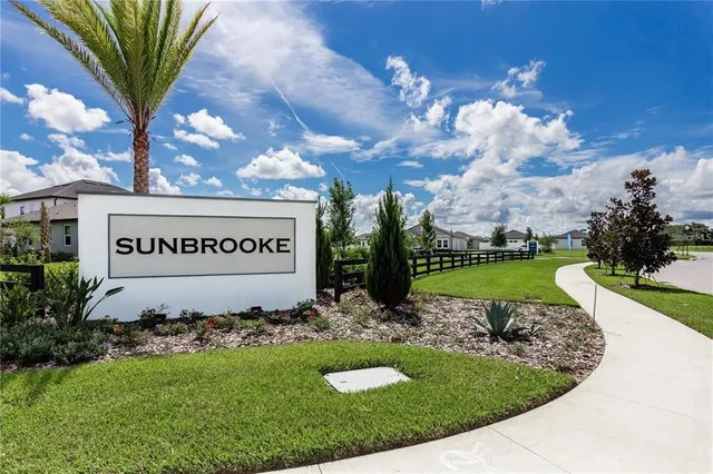 a view of a pathway with a garden