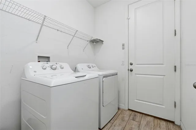 a utility room with dryer and washer