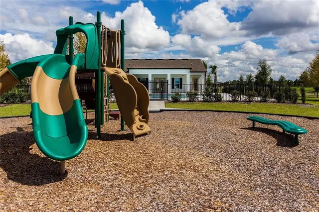 a view of a park with iron fence