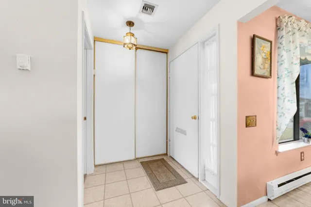 a view of an entryway with wooden floor