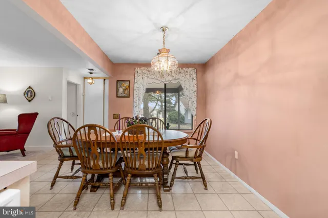 a view of a dining room with furniture and window