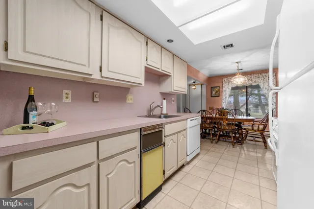 a kitchen with stainless steel appliances granite countertop a sink and cabinets
