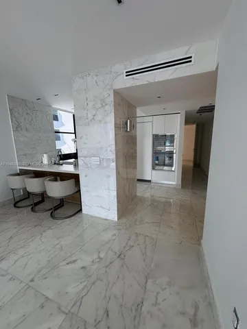 a view of a livingroom with furniture and a window