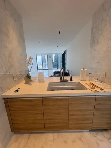 a room with a bed and mirror