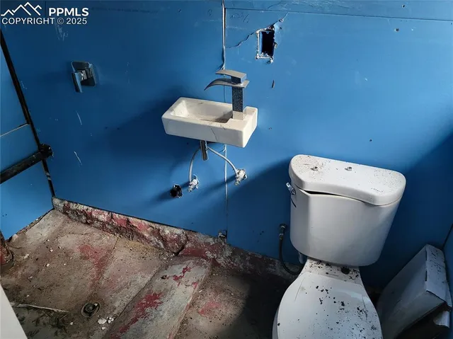 a toilet sitting next to a sink