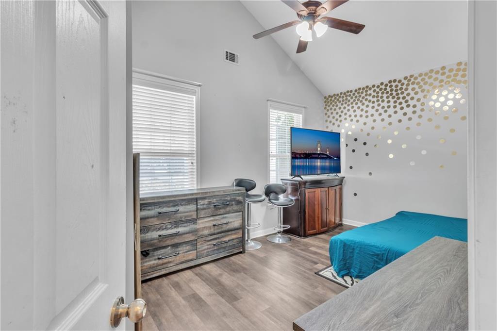 4044 Amberleigh Trace Gainesville, GA 30507 - Photo 11 of 21 a living room with furniture and a flat screen tv