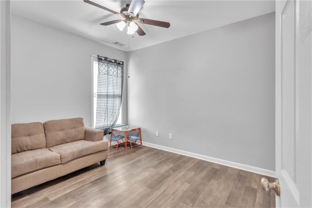 4044 Amberleigh Trace Gainesville, GA 30507 - Photo 12 of 21 a living room with furniture and a window