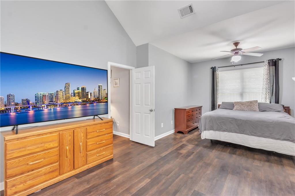 4044 Amberleigh Trace Gainesville, GA 30507 - Photo 20 of 21 a bedroom with a bed and wooden floor