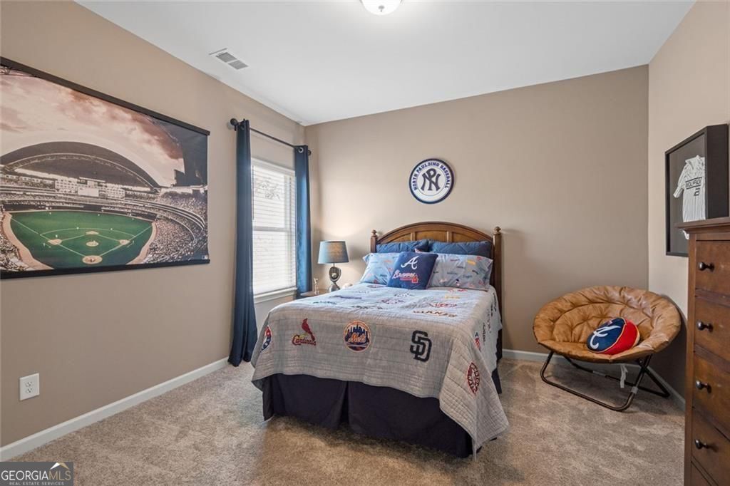 200 Roy Drive Calhoun, GA 30701 - Photo 24 of 29 a bedroom with a bed and a window