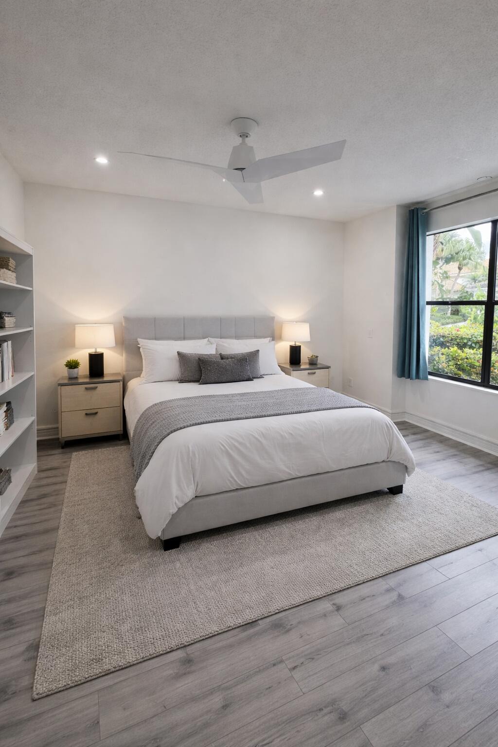 10106 Spyglass Way Boca Raton, FL 33498 - Photo 11 of 56 a bedroom with a large bed and a large window