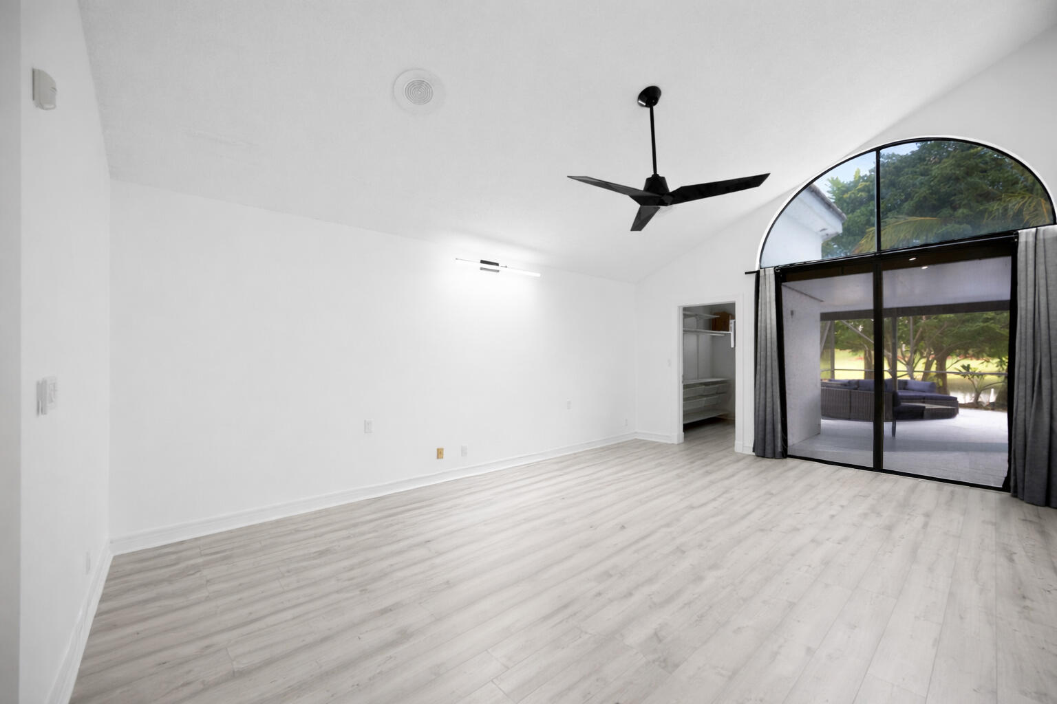 10106 Spyglass Way Boca Raton, FL 33498 - Photo 12 of 56 a view of empty room with wooden floor