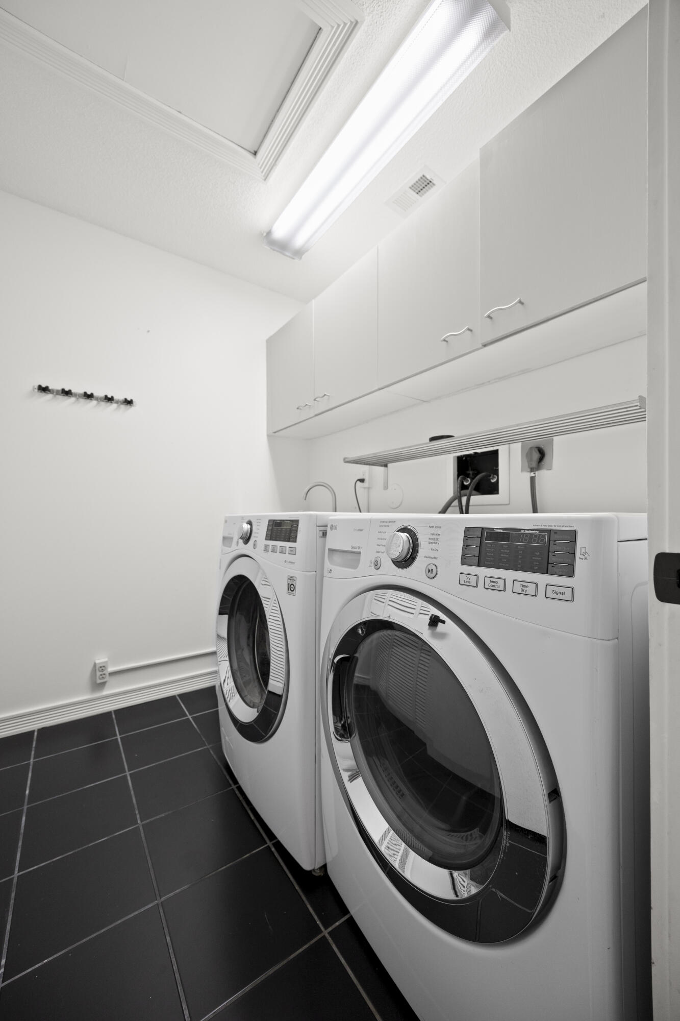 10106 Spyglass Way Boca Raton, FL 33498 - Photo 25 of 56 a utility room with dryer and washer